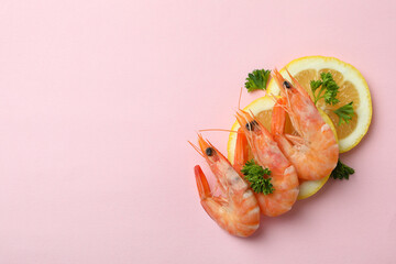 Tasty cooked shrimps on pink background, space for text