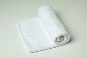 Fototapeta na wymiar Clean rolled towel on white background, close up