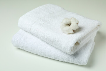 Obraz na płótnie Canvas Clean folded towels and cotton on white background