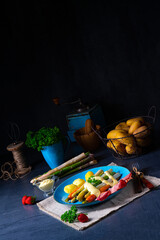 Asparagus with black forest ham, carrots and hollandaise sauce.