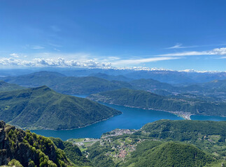 Naklejka na ściany i meble Panorama View from Top of Monte Genereso, Ticino, Switzerland. View to Lugano city, San Salvatore mountain and Lugano lake. 