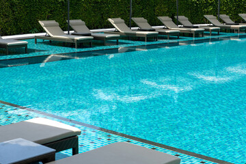 Swimming pool blue transparent water.
