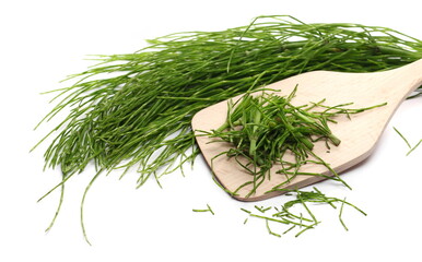 Sliced and chopped fern pile with wooden spoon isolated on white background