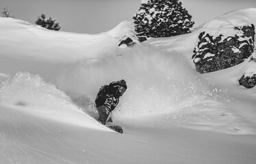 Skier rides on fresh snow against blue sky