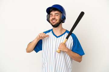 Young caucasian man playing baseball isolated on white background proud and self-satisfied