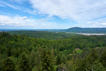 beautiful panarama view from a mountain with forest imposing rocks and under blue sky