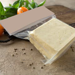 tofu in a package on a light table