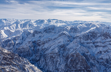 High snowy mountains in winter and blue skies