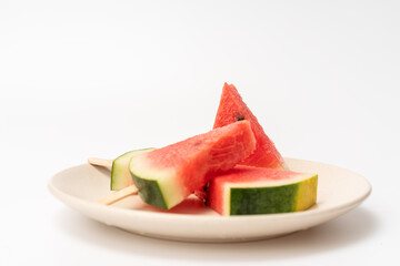 There is watermelon ice cream on the plate