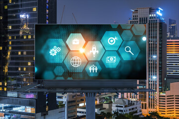 Research and technological development glowing icons on billboard. Night panoramic city view of...