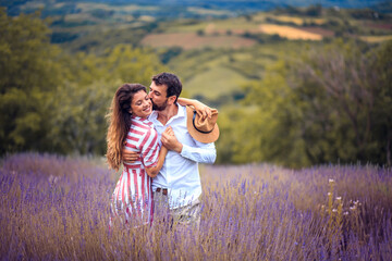 Young couple having fun on lavender field. © liderina