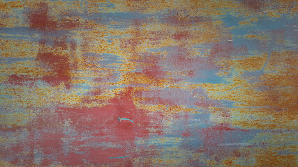 old rusty metal texture with different layers of cracked paint. abstract iron shabby background with copy space