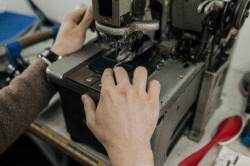 tailor in the workshop for sewing products