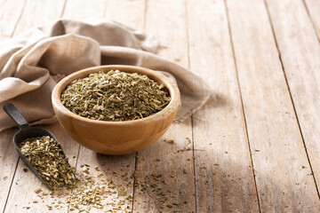 Traditional yerba mate tea in bowl on wooden table. typical Argentine drink.Copy space