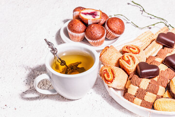 Good mood morning tea with various cookies and muffins
