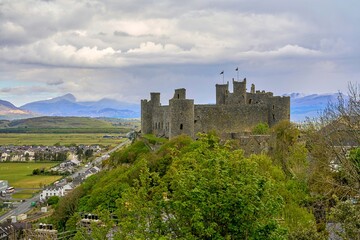 Harlech Castle with snowdonia mountain range in the background, Gwynedd, Wales