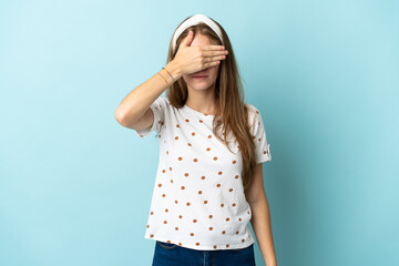 Young caucasian woman over isolated background covering eyes by hands. Do not want to see something