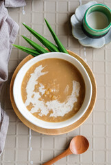 Malaysian Nyonya sweet delicacy / Hot Wheat Porridge with Coconut Milk and Nyonya Kueh / Usually eaten as snacks during tea break
