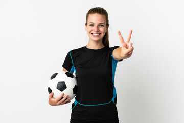 Young football player woman isolated on white background smiling and showing victory sign