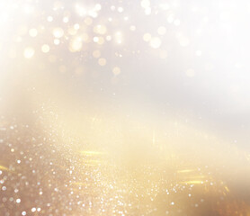 background of abstract gold and silver glitter lights. defocused