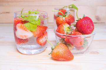 fresh Strawberry mojito cocktail with ice and mint in glass