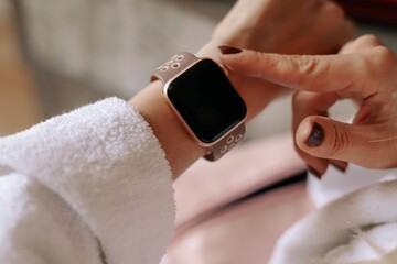 A close-up of the smart watch on a woman hand.