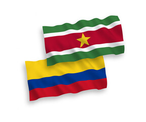 Fototapeta premium Flags of Republic of Suriname and Colombia on a white background
