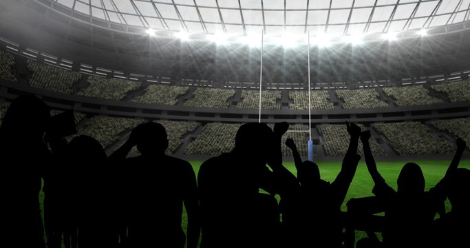 Composition of silhouettes of sports fans cheering on sports stadium