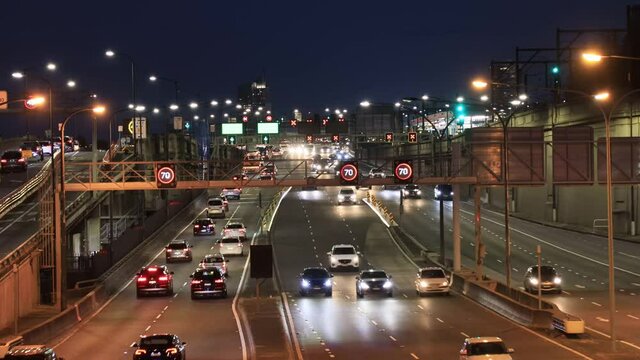 Heavy Motor Traffic Entering Sydney Harbour Bridge At Sunset As 4k.
