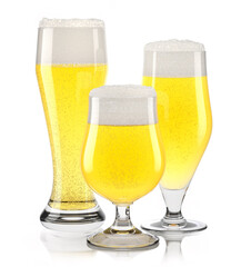 Set of fresh light beer glasses with bubble froth isolated on white background.
