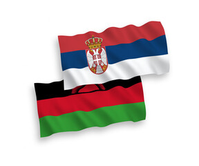 Naklejka premium National vector fabric wave flags of Malawi and Serbia isolated on white background. 1 to 2 proportion.