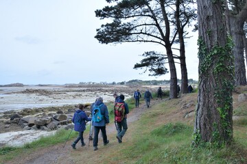 Retired hikers on a path in Brittany. France