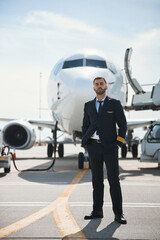Experienced pilot is posing near passenger plane © Viacheslav Yakobchuk