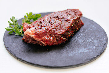 raw meat steak with spices