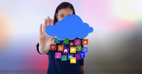 Cloud and multiple digital icons against african american woman gesturing stop sign
