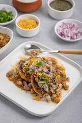 Aloo Tikki or Cutlet or Aloo Patties  dipped in Chickpea curry