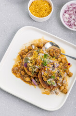 Aloo Tikki or Cutlet or Aloo Patties  dipped in Chickpea curry