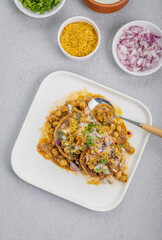 Aloo Tikki or Cutlet or Aloo Patties  dipped in Chickpea curry