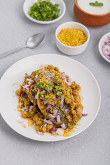 Aloo Tikki or Cutlet or Aloo Patties  dipped in Chickpea curry