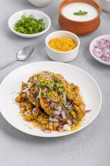 Aloo Tikki or Cutlet or Aloo Patties  dipped in Chickpea curry
