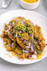 Aloo Tikki or Cutlet or Aloo Patties  dipped in Chickpea curry