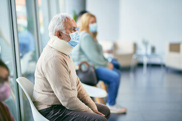 Pensive senior man with neck brace sitting at hospital waiting room during coronavirus pandemic.