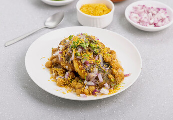 Aloo Tikki or Cutlet or Aloo Patties  dipped in Chickpea curry