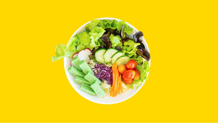 Crab stick salad with yellow isolated background. © Kenshin