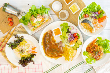Fusion food set on the dinning table.