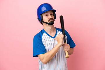 Young caucasian man playing baseball isolated on pink background proud and self-satisfied