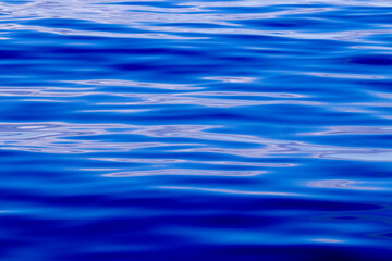 Naklejka premium Blue pattern, waves of the ocean, calm sea, nature details.