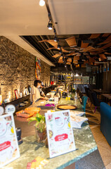 Interior of cozy restaurant in Latin American style. Bar counte