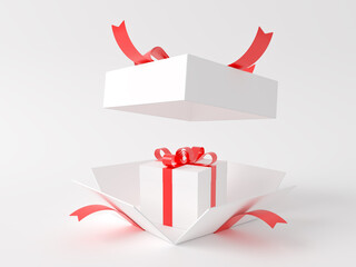Within a white gift box with a red ribbon was another gift box. 3D Illustration.