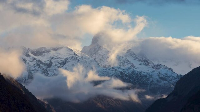 The Olan peak in the Ecrins National Park with passing clouds (time-lapse). Major peak of the GR54 Ecrins Massif hiking tour. Valgaudemar Valley in the
 Hautes-Alpes, French Alps, France